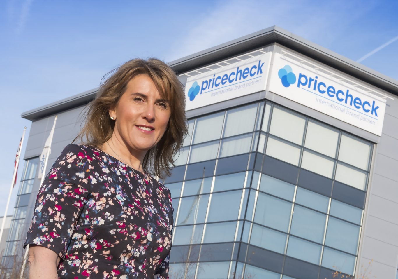 Woman in front of the Pricecheck building