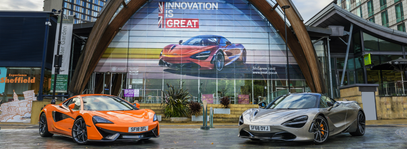 Two McLaren supercars outside the Sheffield Winter Gardens